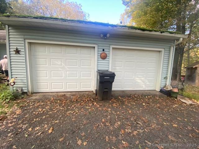 garage featuring driveway