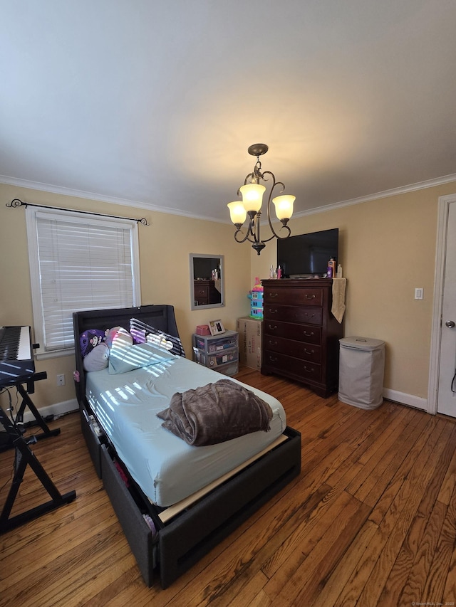 bedroom with baseboards, a notable chandelier, ornamental molding, and wood finished floors