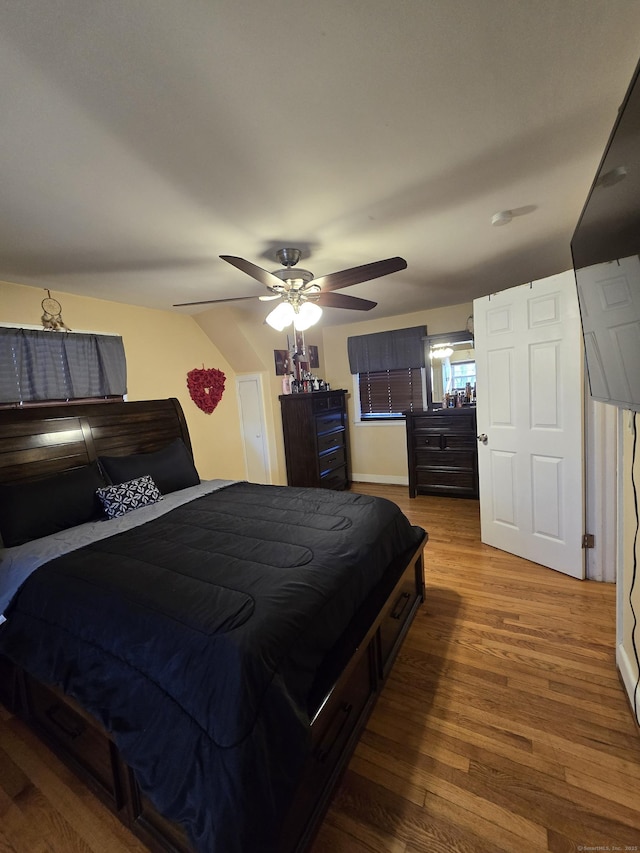 bedroom with ceiling fan and wood finished floors