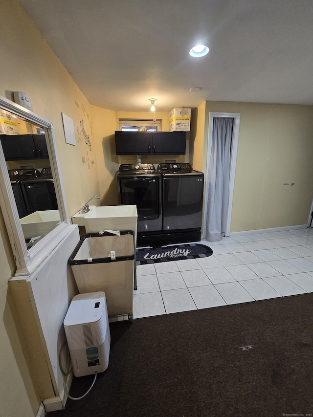 kitchen featuring recessed lighting, light tile patterned flooring, a sink, and independent washer and dryer