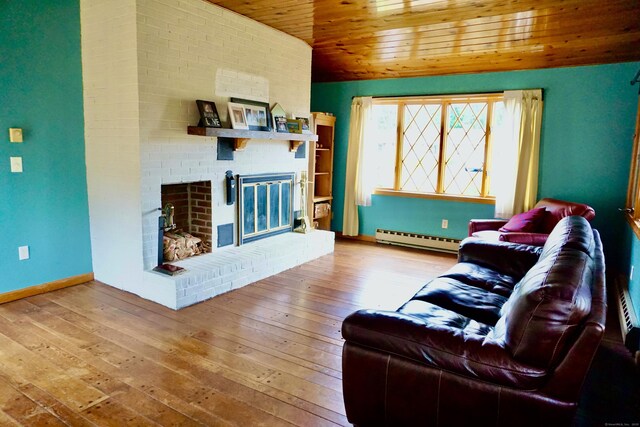 living area featuring wooden ceiling, wood-type flooring, a fireplace, and a baseboard heating unit