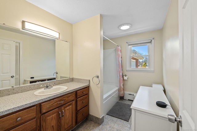 bathroom with tile patterned floors, shower / bath combo with shower curtain, baseboards, baseboard heating, and vanity