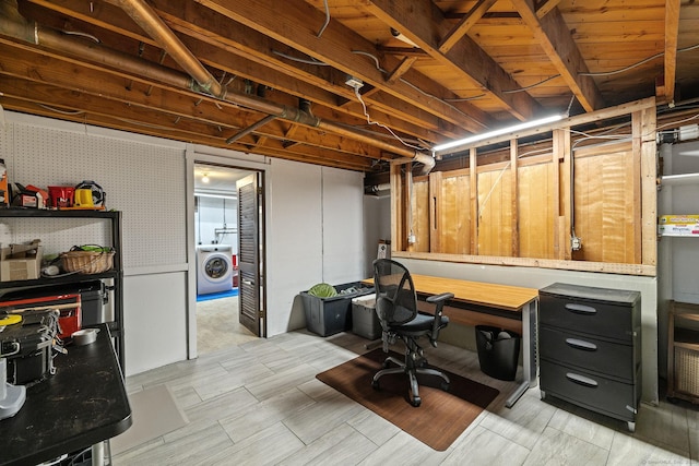 office space featuring wallpapered walls and washer / clothes dryer