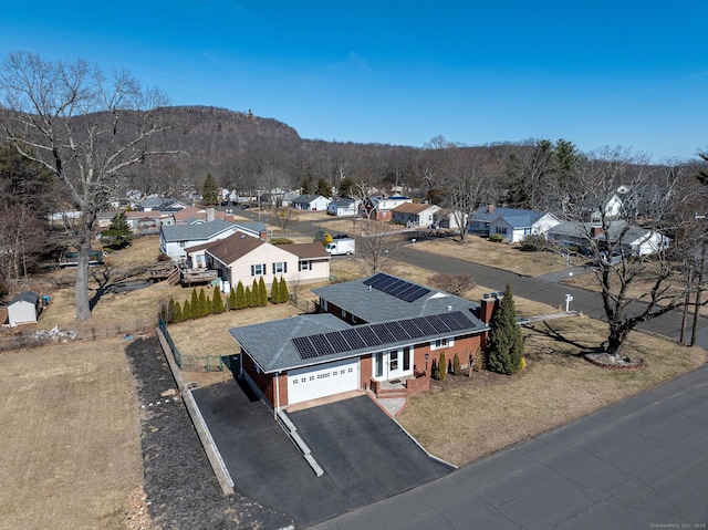 birds eye view of property with a mountain view and a residential view