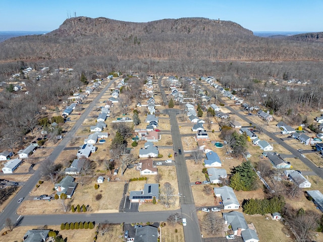 drone / aerial view featuring a residential view and a mountain view
