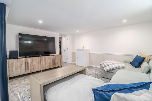 living area with baseboards and recessed lighting