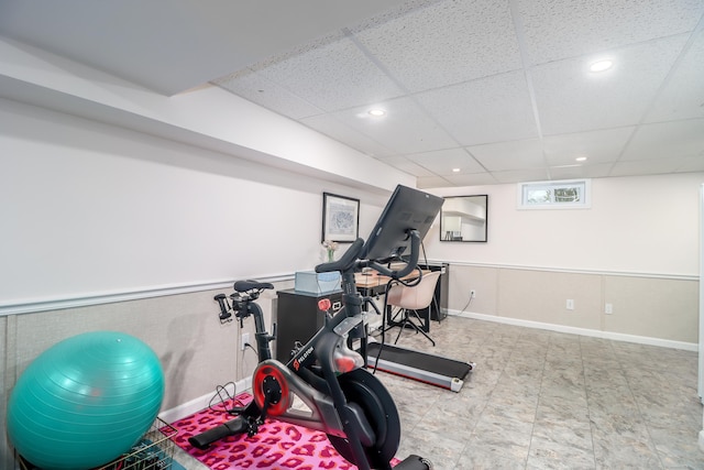 workout area with a paneled ceiling, baseboards, and recessed lighting