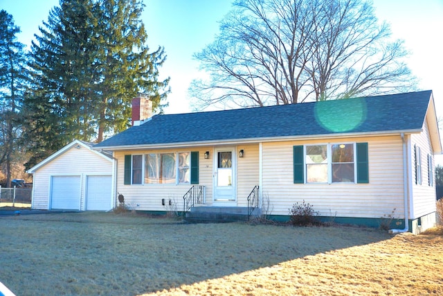 single story home featuring a garage, a chimney, a front lawn, and an outdoor structure