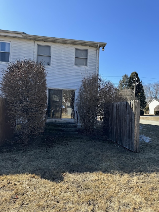 rear view of house with fence