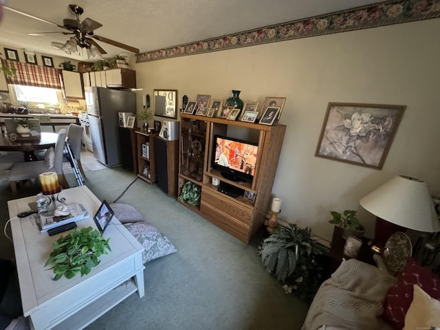 living area featuring a ceiling fan and light colored carpet