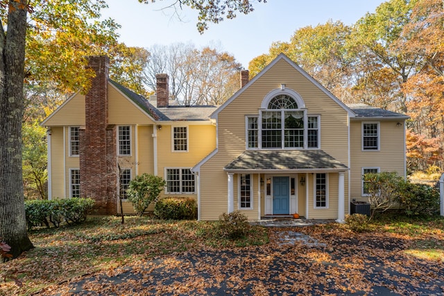 604 W Lake Ave, Guilford, CT 06437 - traditional-style home with a chimney and cooling unit