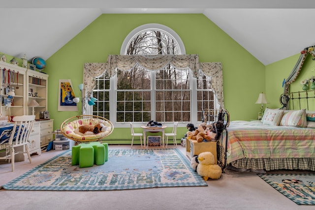 carpeted bedroom with lofted ceiling