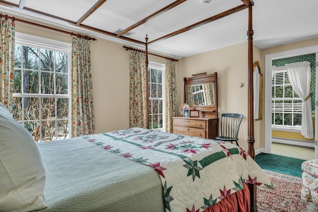 bedroom with carpet, baseboards, and a baseboard radiator