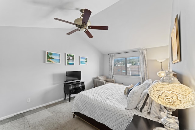 carpeted bedroom featuring vaulted ceiling, baseboards, and ceiling fan