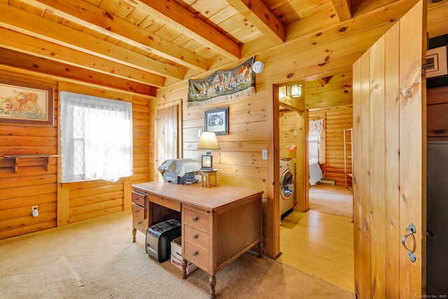 office space with beam ceiling, wood walls, washer / clothes dryer, and wood ceiling