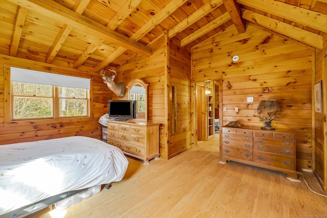 bedroom with wooden walls, wood ceiling, light wood-style flooring, and vaulted ceiling with beams