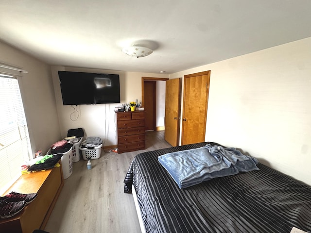 bedroom featuring wood finished floors