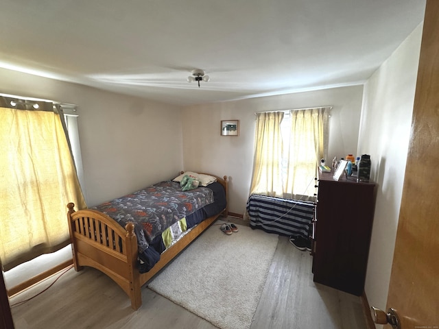 bedroom featuring wood finished floors