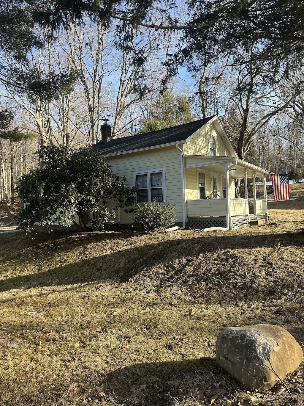 110 Falls Rd, East Haddam, CT 06469 - view of side of home featuring covered porch and a chimney