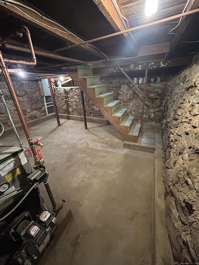 unfinished basement with stairs