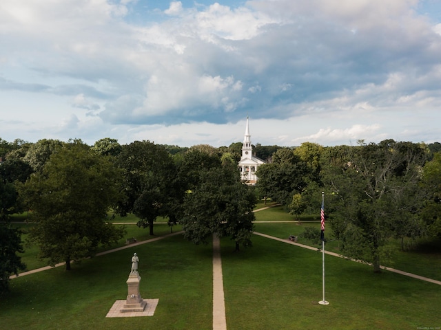 view of home's community with a yard