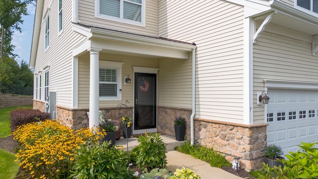 view of exterior entry featuring stone siding