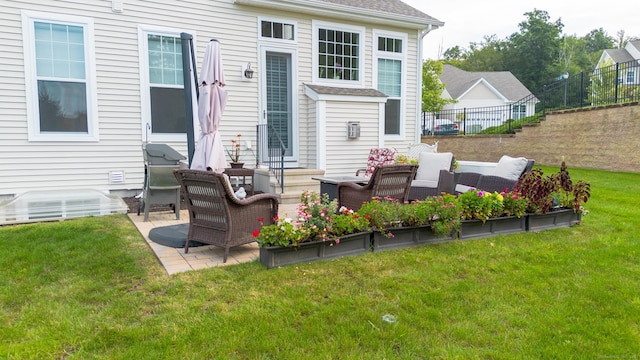 exterior space featuring roof with shingles, a patio, a lawn, fence, and an outdoor living space