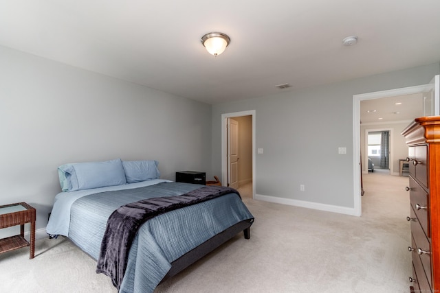 bedroom with recessed lighting, light colored carpet, visible vents, and baseboards