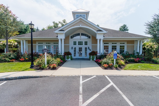 view of building exterior featuring uncovered parking