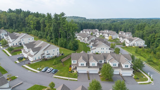 aerial view with a residential view and a view of trees