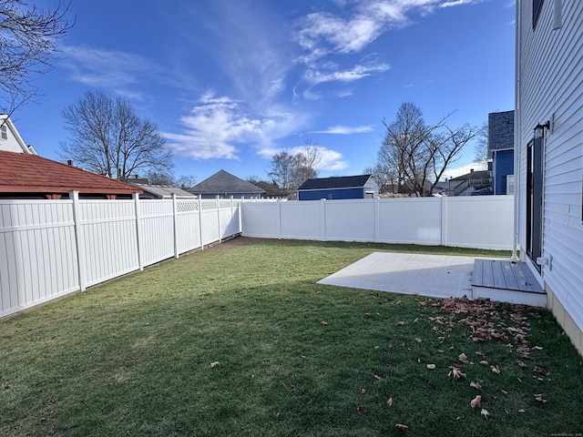 view of yard featuring a fenced backyard and a patio