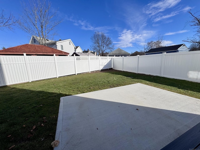 view of yard featuring a fenced backyard and a patio