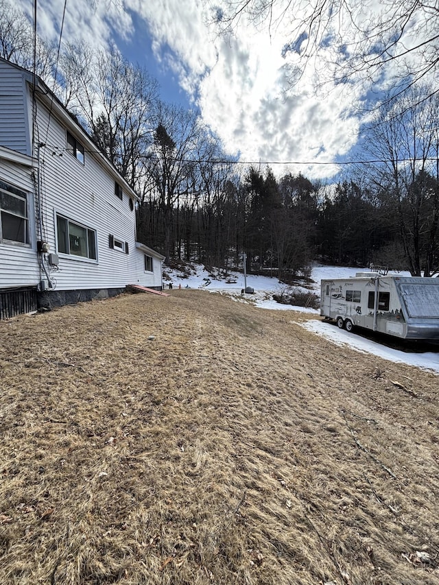 view of yard covered in snow