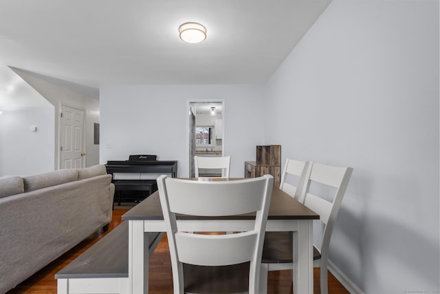 dining area with dark wood-type flooring