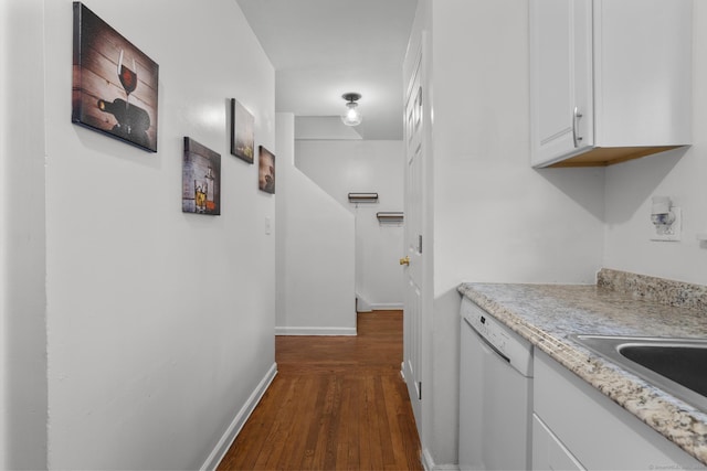 interior space featuring dark wood-type flooring and baseboards