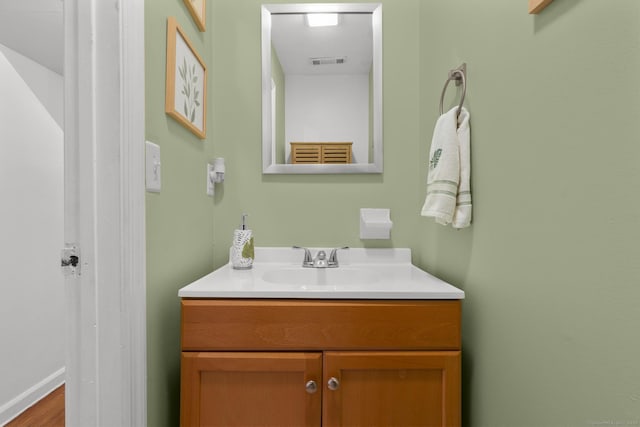 bathroom featuring vanity and visible vents