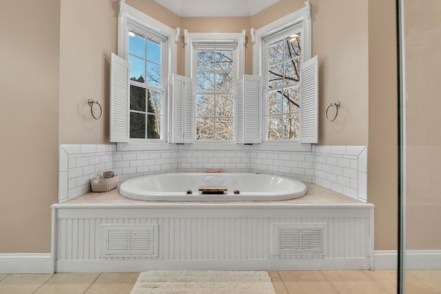 full bathroom with tasteful backsplash, a garden tub, visible vents, and tile patterned floors