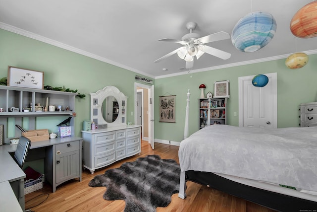 bedroom with light wood-type flooring, ceiling fan, baseboards, and crown molding