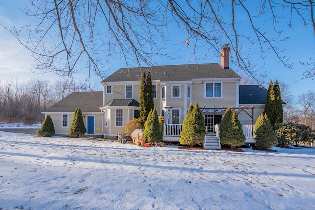 colonial inspired home with a chimney