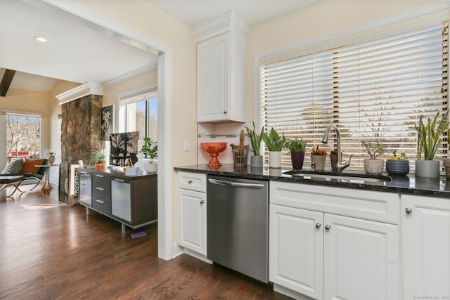 kitchen with dark wood-type flooring, a sink, white cabinetry, backsplash, and dishwasher