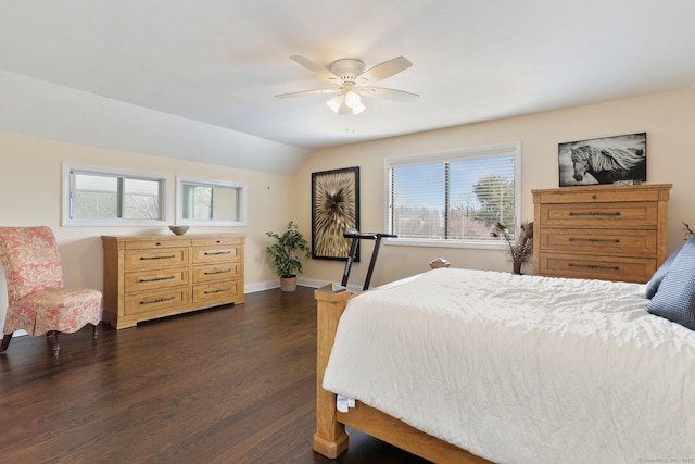 bedroom with lofted ceiling, dark wood-type flooring, a ceiling fan, and baseboards