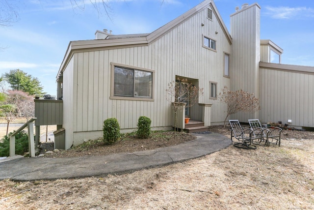 back of property featuring a chimney