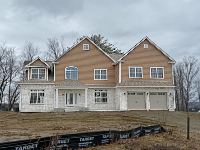 view of front of house with aphalt driveway, a garage, a shingled roof, french doors, and a front lawn