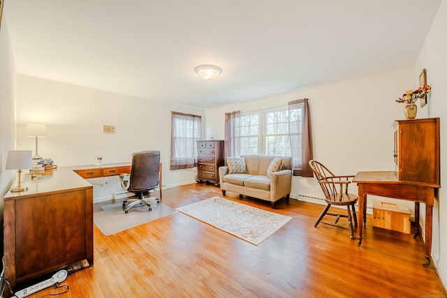 home office with wood finished floors and baseboards