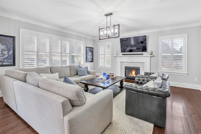 living room featuring ornamental molding, dark wood-style flooring, baseboards, and a tiled fireplace