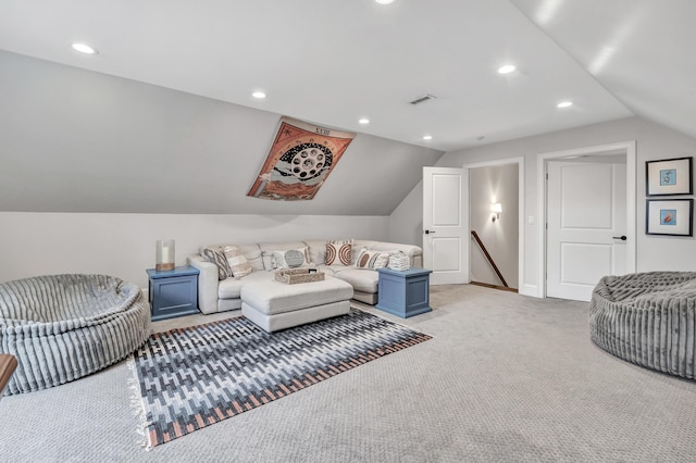 living area featuring lofted ceiling, recessed lighting, light colored carpet, visible vents, and baseboards