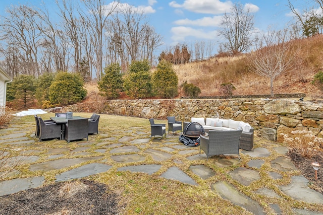 view of patio / terrace featuring an outdoor fire pit and outdoor dining space