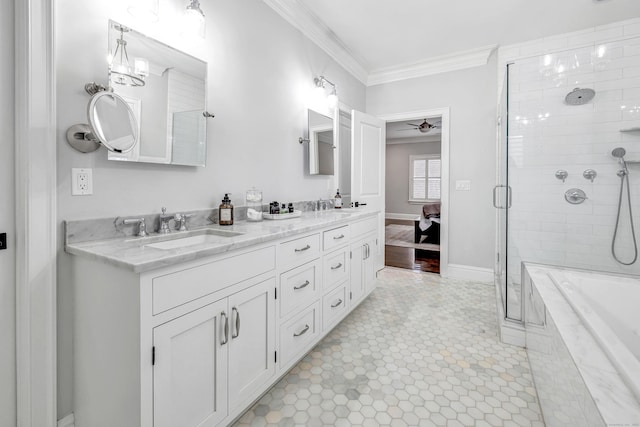 full bath featuring double vanity, ornamental molding, a ceiling fan, a sink, and tiled shower