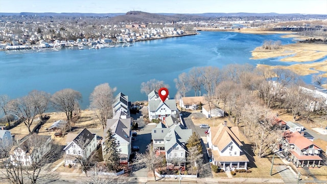 birds eye view of property featuring a residential view and a water view