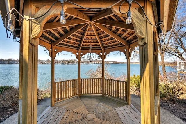 view of dock with a gazebo and a water view